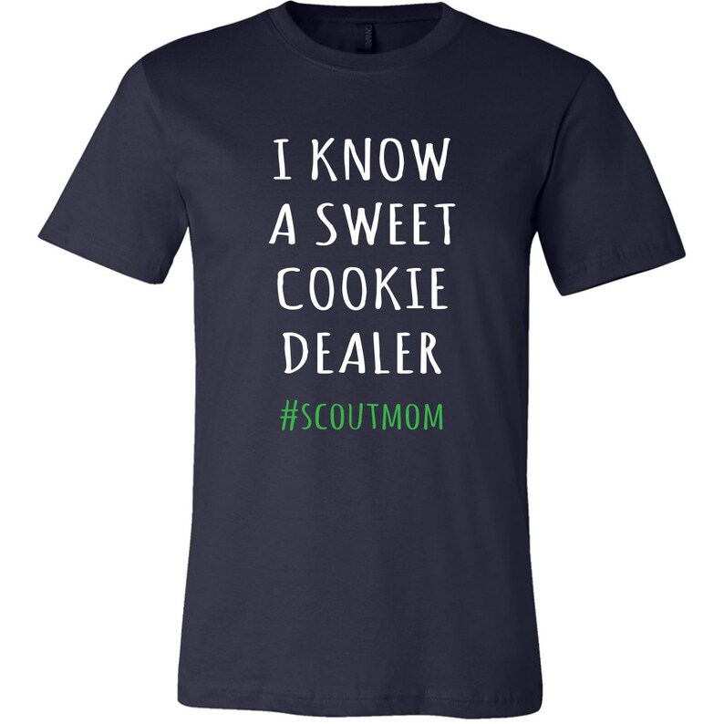 May include: Navy blue t-shirt with white text that reads "I know a sweet cookie dealer #scoutmom".