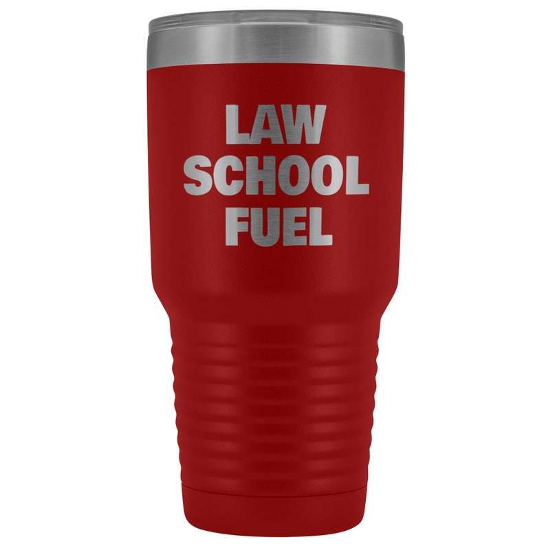 May include: Red stainless steel tumbler with a silver lid and the text "LAW SCHOOL FUEL" in silver lettering.