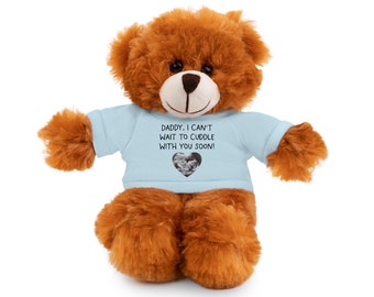 May include: A brown teddy bear wearing a light blue shirt with the text "Daddy, I can't wait to cuddle with you soon!" and a heart-shaped photo of an ultrasound image.