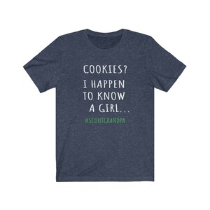 Puede incluir: Una camiseta azul marino con texto blanco que dice "COOKIES? I HAPPEN TO KNOW A GIRL... #SCOUTGRANDPA".