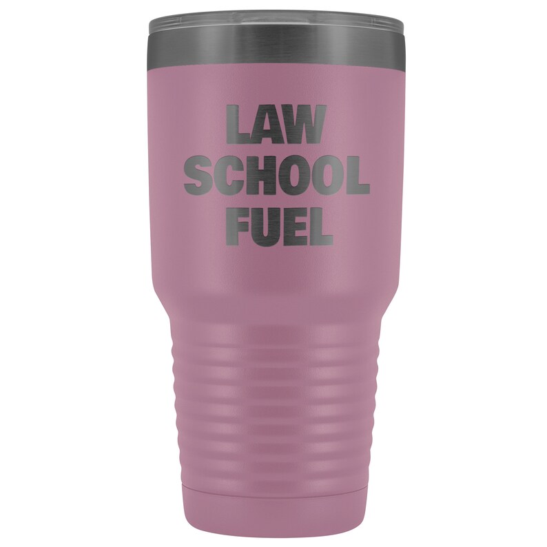 May include: A mauve stainless steel tumbler with a black lid and the text "LAW SCHOOL FUEL" printed on the side.