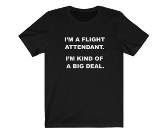 May include: Black t-shirt with white text that reads "I'm a flight attendant. I'm kind of a big deal."