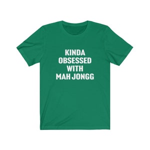 May include: A green t-shirt with the text "Kinda obsessed with Mah Jongg" in white.