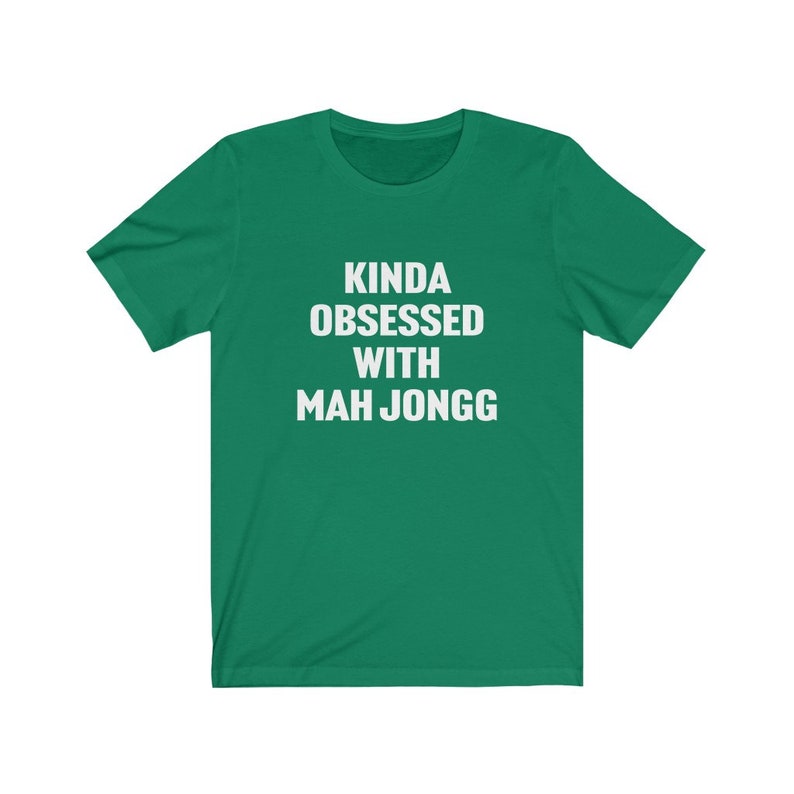 May include: A green t-shirt with the text "Kinda obsessed with Mah Jongg" in white.