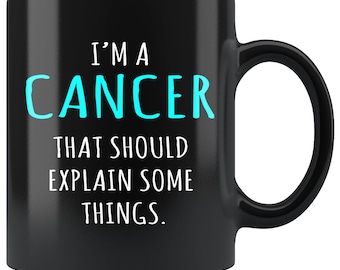 May include: Black coffee mug with white text that reads "I'm a Cancer that should explain some things."