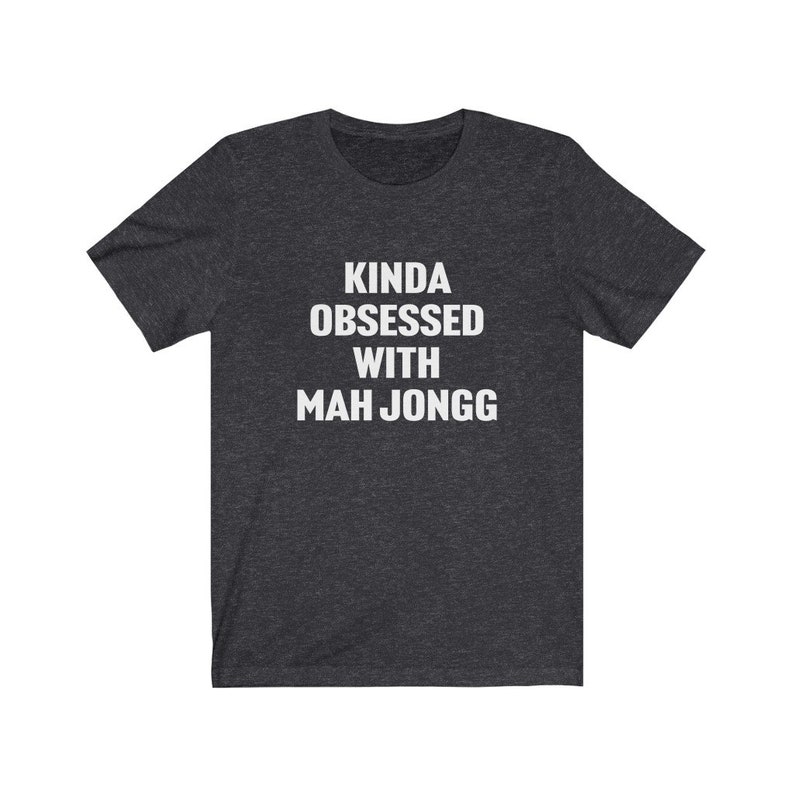 May include: A dark heather grey t-shirt with the text "Kinda obsessed with Mah Jongg" printed in white.