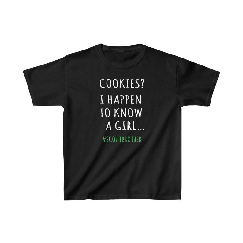 May include: Black t-shirt with white text that reads "COOKIES? I HAPPEN TO KNOW A GIRL... #SCOUTBROTHER".