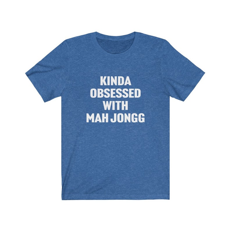 May include: A blue t-shirt with white text that reads "Kinda obsessed with Mah Jongg".