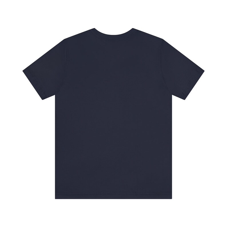 May include: A plain navy blue t-shirt with short sleeves.