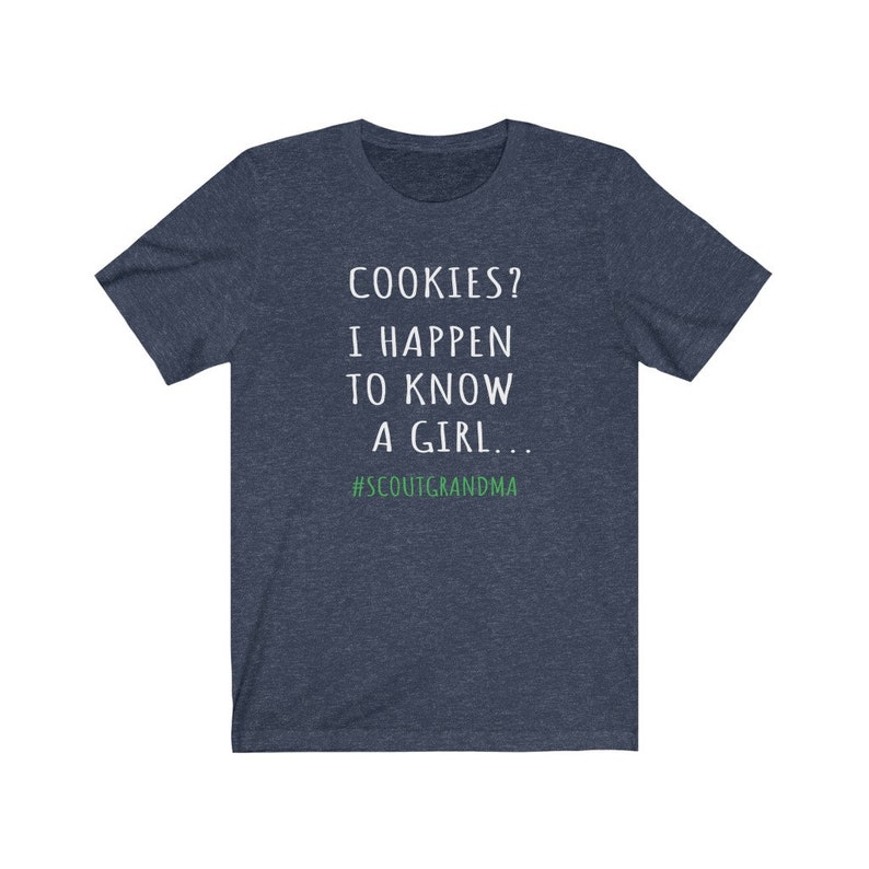Puede incluir: Una camiseta azul marino con texto blanco que dice "COOKIES? I HAPPEN TO KNOW A GIRL... #SCOUTGRANDMA".