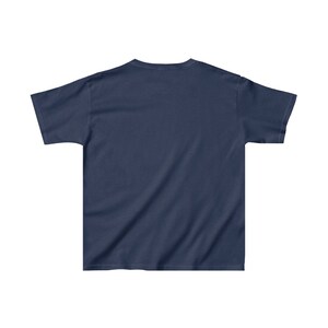 May include: A plain navy blue t-shirt with short sleeves.