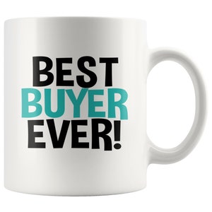 May include: White ceramic coffee mug with black text that reads "BEST BUYER EVER!" The word "BUYER" is in teal.