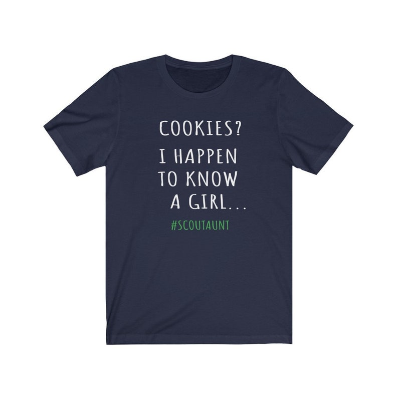 May include: Navy blue t-shirt with white text that reads "COOKIES? I HAPPEN TO KNOW A GIRL... #SCOUTAUNT"