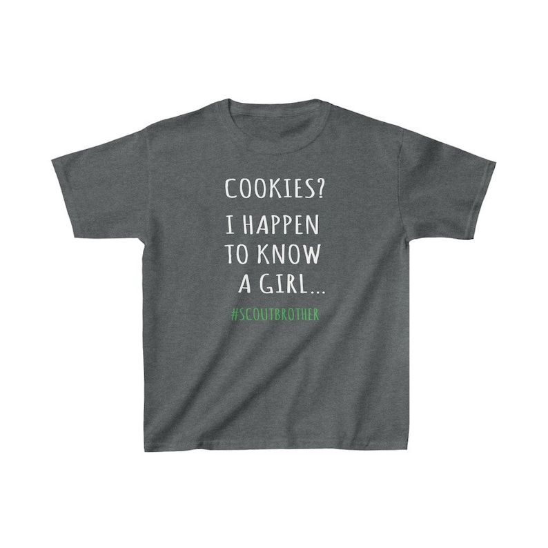 May include: A dark heather grey t-shirt with white text that reads "COOKIES? I HAPPEN TO KNOW A GIRL... #SCOUTBROTHER".