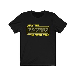 May include: Black t-shirt with a yellow graphic that says "May the Forties Be With You" in a Star Wars-inspired font.