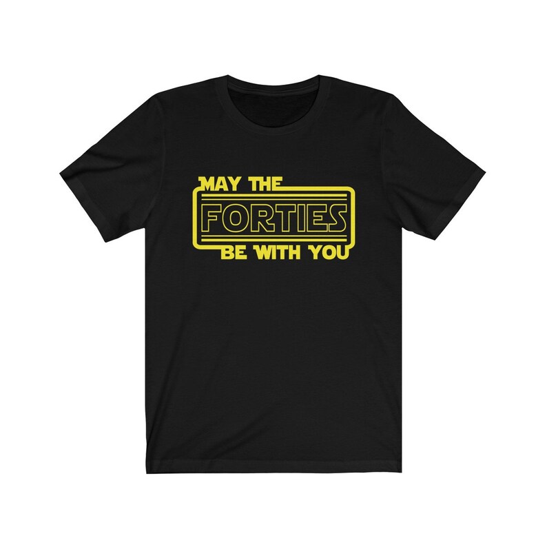 May include: Black t-shirt with a yellow graphic that says "May the Forties Be With You" in a Star Wars-inspired font.