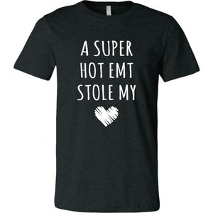 May include: A dark heather grey t-shirt with the text "A super hot EMT stole my" and a white heart graphic.