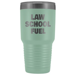 May include: A green stainless steel tumbler with the text "LAW SCHOOL FUEL" in black lettering.