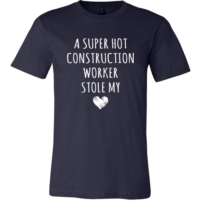 May include: A navy blue t-shirt with white text that reads "A super hot construction worker stole my heart".