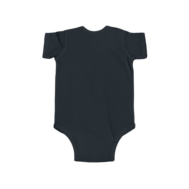 May include: A plain black baby onesie with short sleeves.