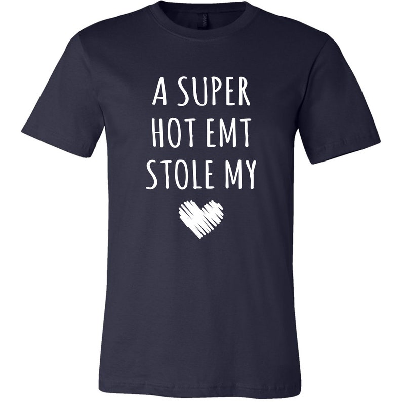 May include: A navy blue t-shirt with white text that reads "A super hot EMT stole my heart".