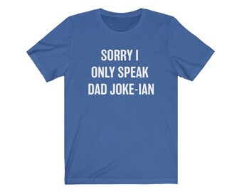 May include: A royal blue t-shirt with white text that reads "Sorry I only speak Dad Joke-ian".