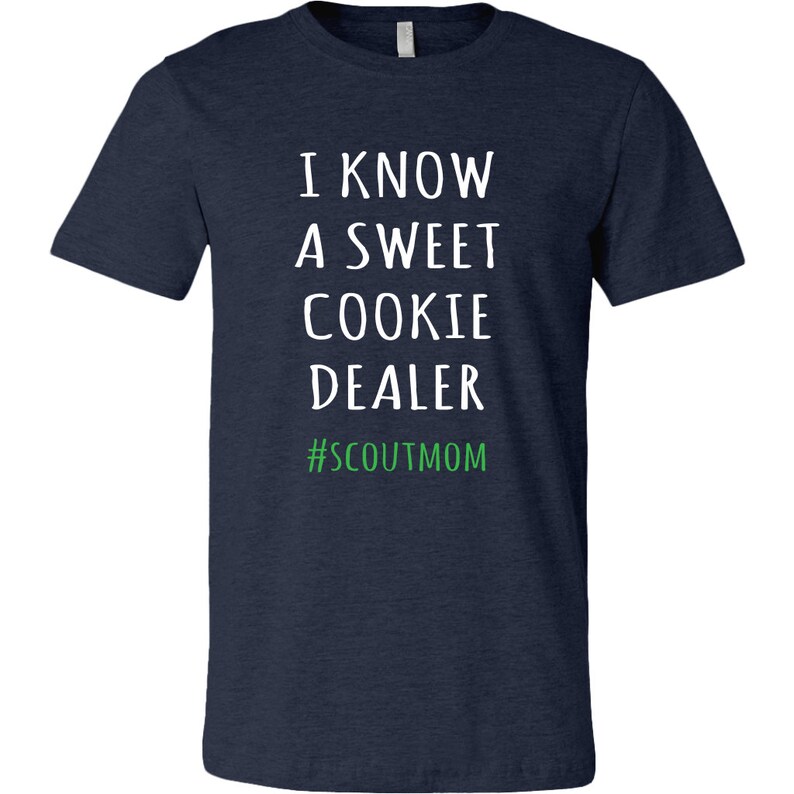 May include: Navy blue t-shirt with white text that reads "I know a sweet cookie dealer #scoutmom".