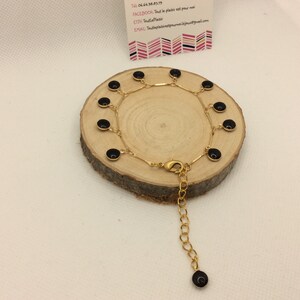 Ref. 802 - Gold metal bracelet with black enamel sequins