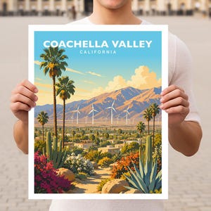 May include: A rectangular art print featuring a landscape illustration of Coachella Valley, California. The scene depicts palm trees, cacti, desert flora, wind turbines, and mountains under a blue sky with the text COACHELLA VALLEY CALIFORNIA.