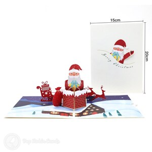 Tarjeta emergente hecha a mano 3D de Papá Noel en chimenea