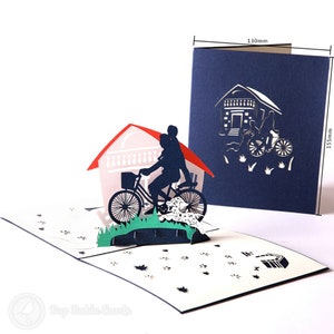 Biglietto pop-up 3D con genitore e figlio in sella alla bicicletta
