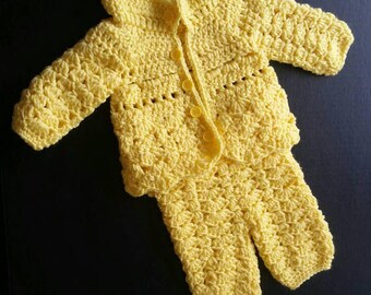 yellow knitted baby outfit