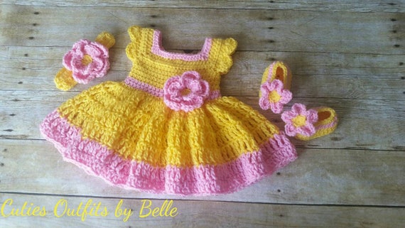 yellow knitted baby outfit