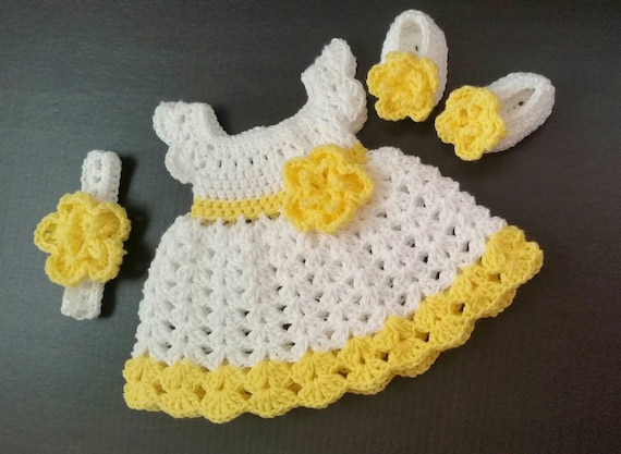 yellow knitted baby outfit