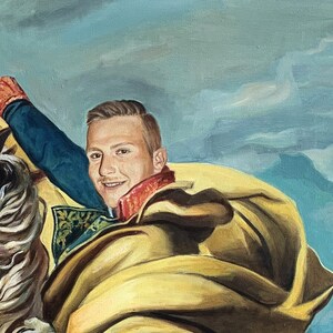 May include: A painting of a person in a blue and gold uniform, riding a white horse. The person is smiling and has a red sash around their neck.