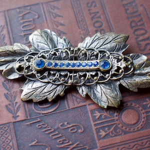 Vintage 1930s Filigree Stamped Leaf Brooch Blue Rhinestone Pin
