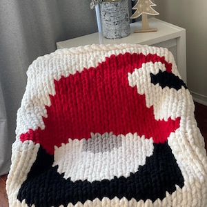 Schema per lavorare a maglia con le dita la coperta natalizia a forma di gnomo: coperta in ciniglia spessa (PDF)