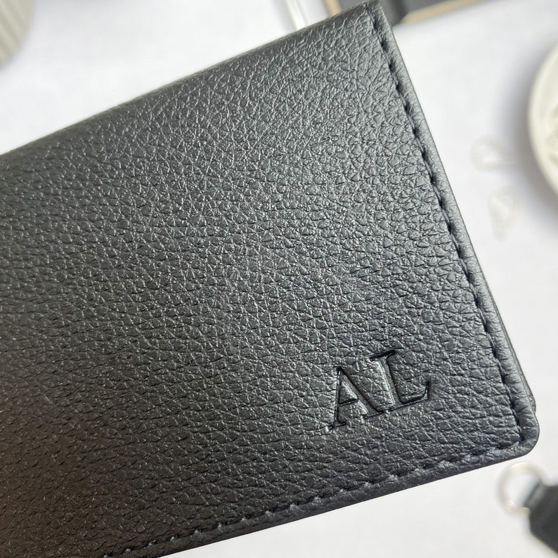 Small black card holder in a textured vegan leather, personalised with initials in the bottom right corner