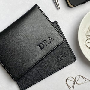 Black card holders with initials in vegan leather, personalised in the bottom right corners