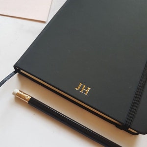 Black notebook in A5 size with gold personalised initials