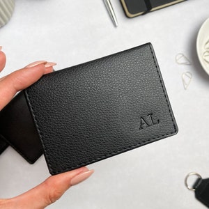 Small black card holder in a textured vegan leather, personalised with initials in the bottom right corner