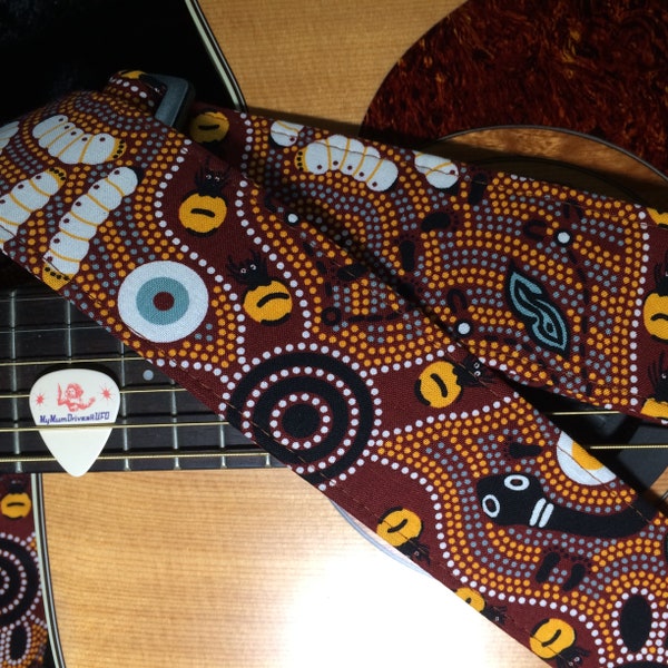 Aboriginal dot-pattern guitar strap // traditional circles design in shades of brown, yellow, black, white // acoustic electric bass guitar