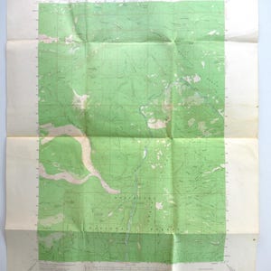 May include: A vintage United States Department of the Interior Geological Survey topographic map of the Whitewater River area in Oregon. The paper map features a green grid overlay, contour lines, and text detailing the Deschutes National Forest.