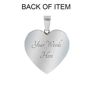 May include: Silver heart-shaped pendant with a blank space for engraving. The text "Your Words Here" is engraved on the back of the pendant.