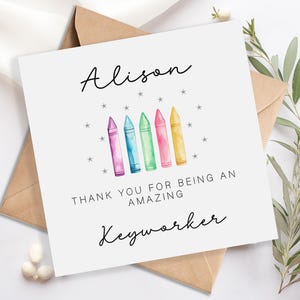 May include: A white ceramic mug with a black handle and the text "But first, coffee" in a handwritten style. The mug is on a white surface. The mug is 10 cm tall.