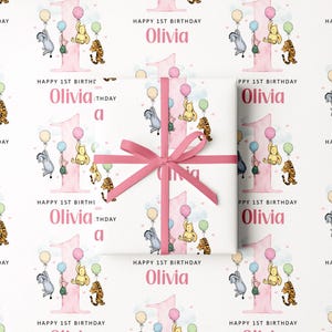 The image is a repeating pattern of a pink gift box with a bow, featuring illustrations of Winnie the Pooh and other characters, along with the text "Happy 1st Birthday Olivia" and "Happy 1st Birthday" written on it.