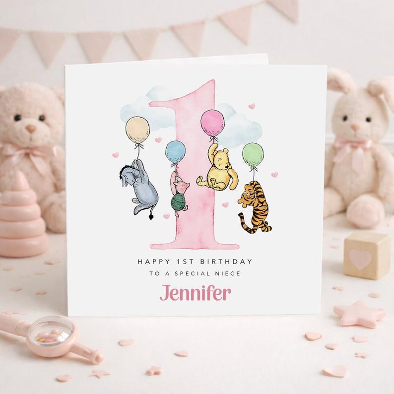 A personalized birthday card for a baby girl named Jennifer, featuring illustrations of Winnie the Pooh and other characters, along with balloons and a pink number one.