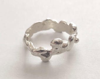 Sterling silver ring with melted wax droplets