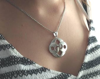 Roswell Stone Pendant. Rhodium-plated brass with a steel chain. Alien mystery in a futuristic piece of jewelry.