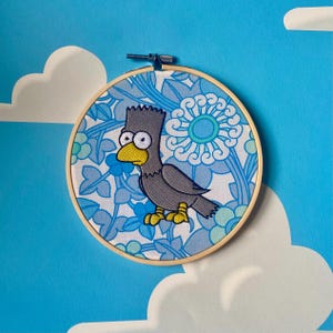 NUNCA MÁS - Arte mural con bastidor de bordado floral de Los Simpsons